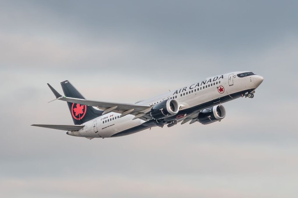 Air Canada Boeing 737 Max takes to the sky, showcasing flight and travel.